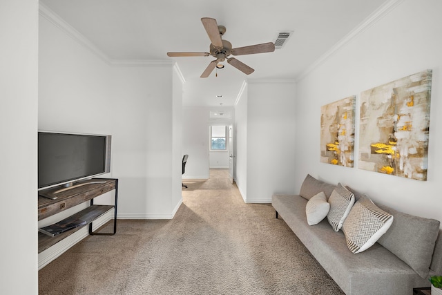 carpeted living room with ceiling fan and ornamental molding