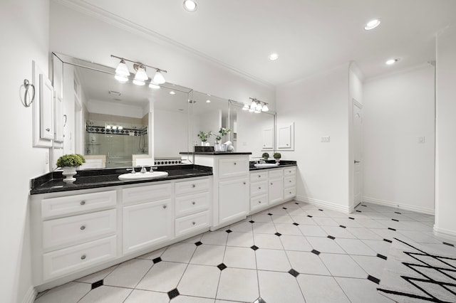 bathroom with vanity, an enclosed shower, and ornamental molding