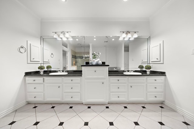 bathroom with tile patterned floors, crown molding, and vanity