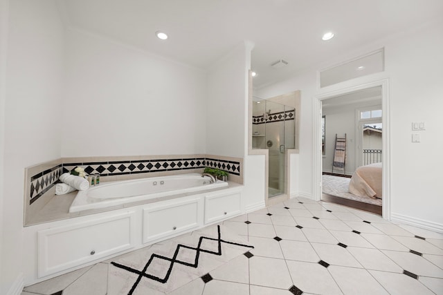 bathroom with tile patterned floors, crown molding, and shower with separate bathtub