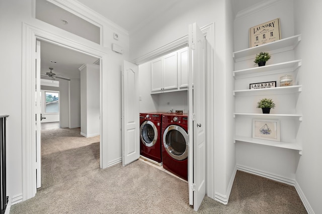 washroom featuring cabinets, light carpet, ceiling fan, separate washer and dryer, and ornamental molding