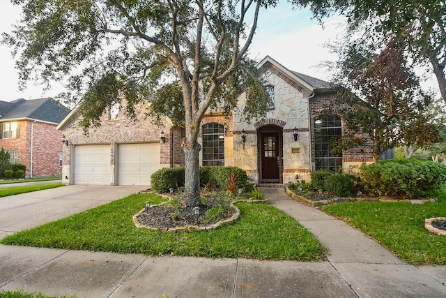 view of front facade featuring a front yard and a garage