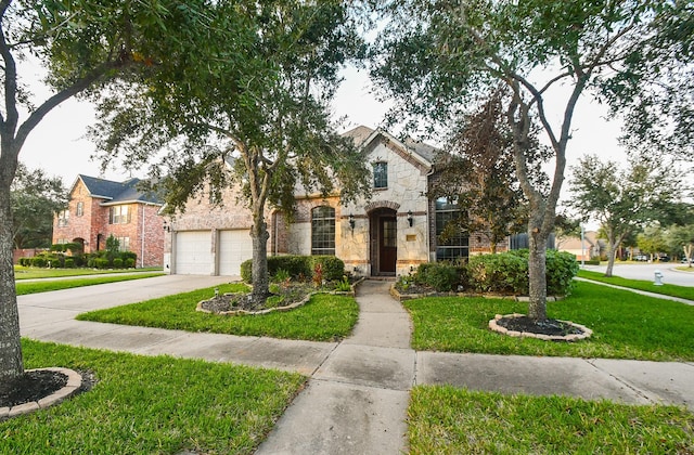 view of front of home with a front yard and a garage