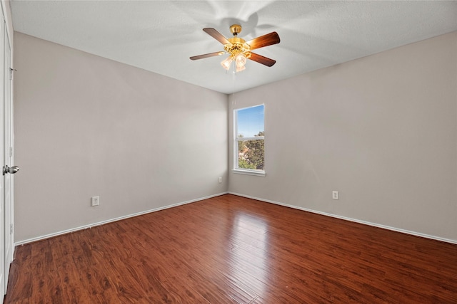 empty room with hardwood / wood-style flooring and ceiling fan