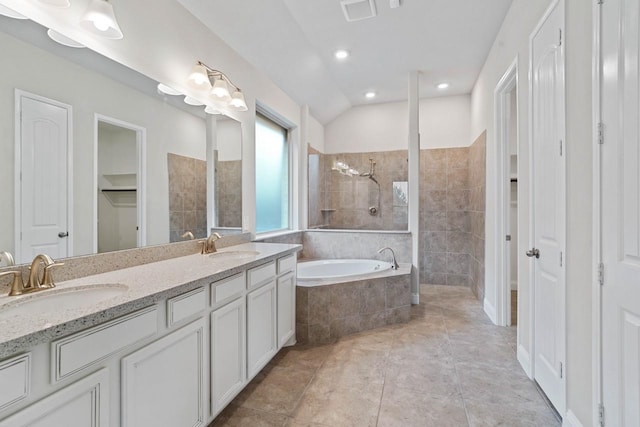 full bath featuring a bath, visible vents, a walk in shower, and a sink