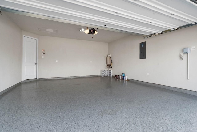 garage with a garage door opener, electric panel, and baseboards