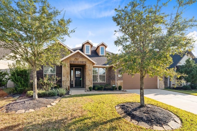 view of front facade featuring a garage, a front yard, stone siding, and driveway