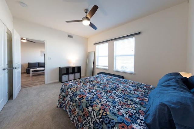 carpeted bedroom featuring ceiling fan