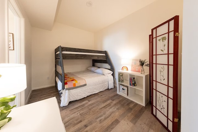 bedroom featuring dark hardwood / wood-style flooring