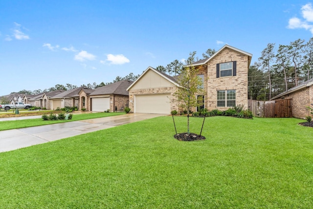 view of front of property featuring a front yard and a garage