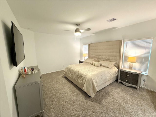 bedroom featuring carpet, multiple windows, and ceiling fan