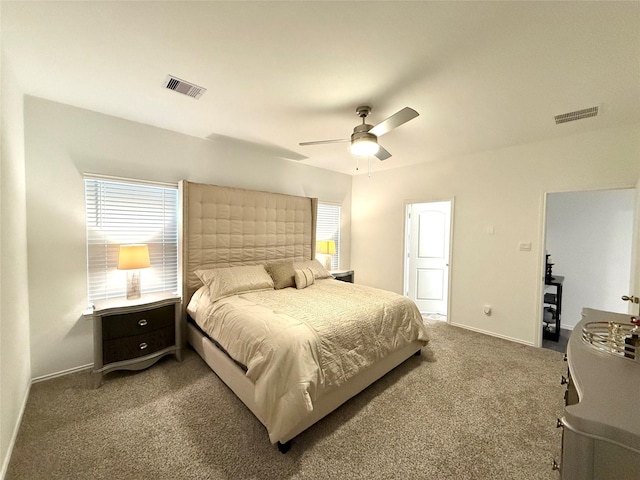 bedroom featuring carpet flooring, multiple windows, and ceiling fan