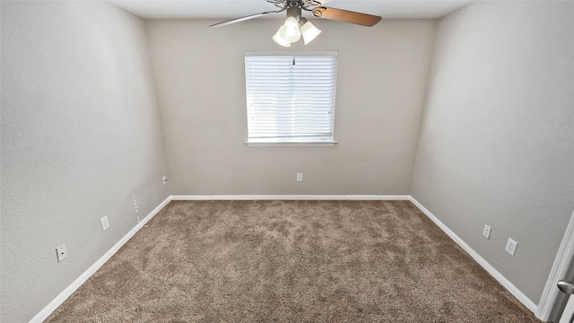 spare room with carpet flooring and ceiling fan