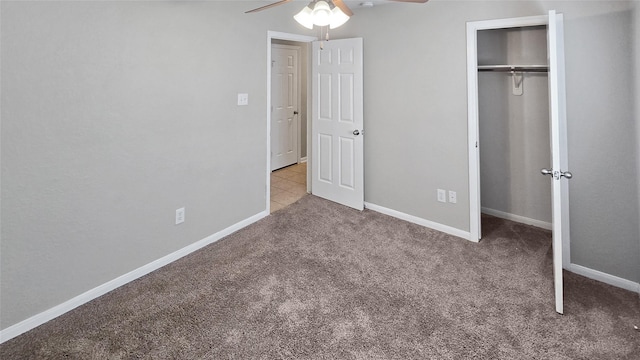 unfurnished bedroom featuring ceiling fan, light colored carpet, and a closet