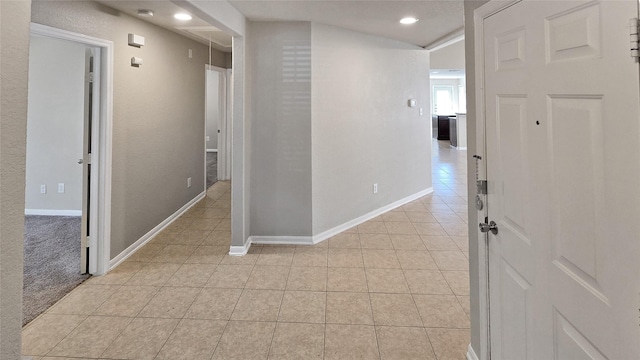 hallway featuring light tile patterned flooring