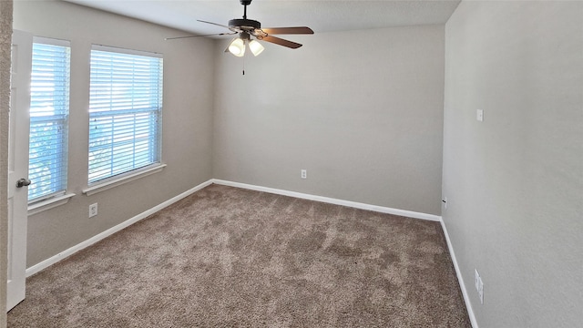 spare room featuring carpet flooring and ceiling fan