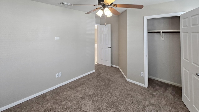 unfurnished bedroom with ceiling fan, a closet, and dark carpet