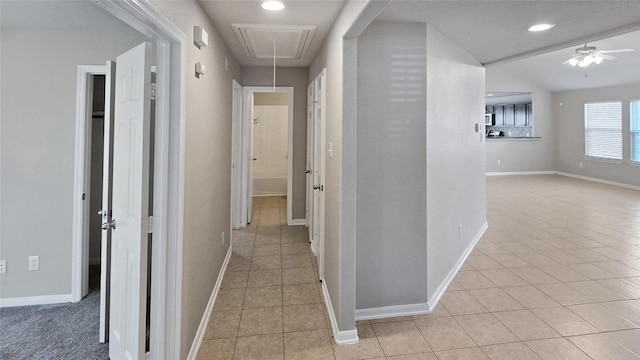 hallway featuring light tile patterned flooring