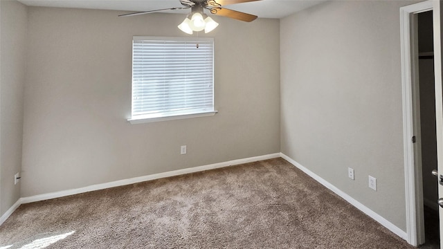 carpeted empty room featuring ceiling fan