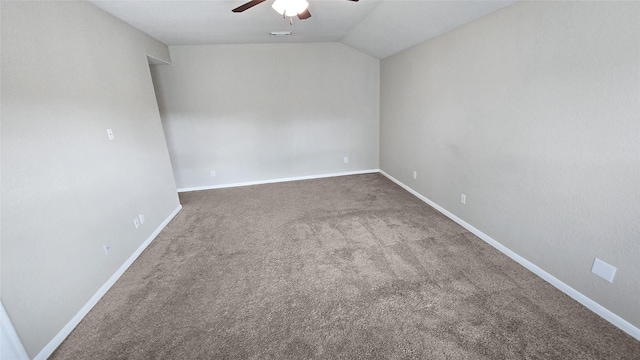 carpeted empty room with ceiling fan and lofted ceiling