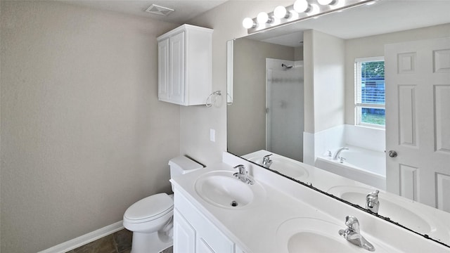 full bathroom with tile patterned floors, toilet, vanity, and shower with separate bathtub