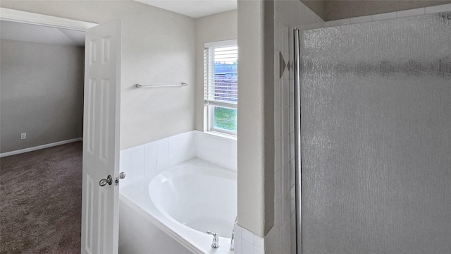 bathroom with separate shower and tub and plenty of natural light