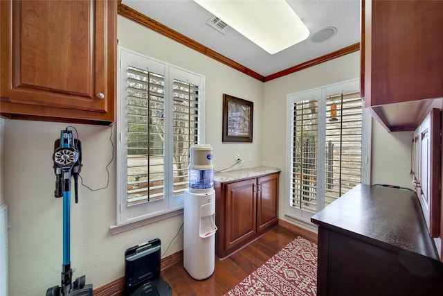 office area with dark hardwood / wood-style floors and ornamental molding