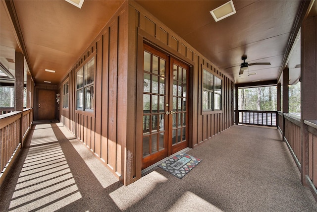 exterior space featuring ceiling fan