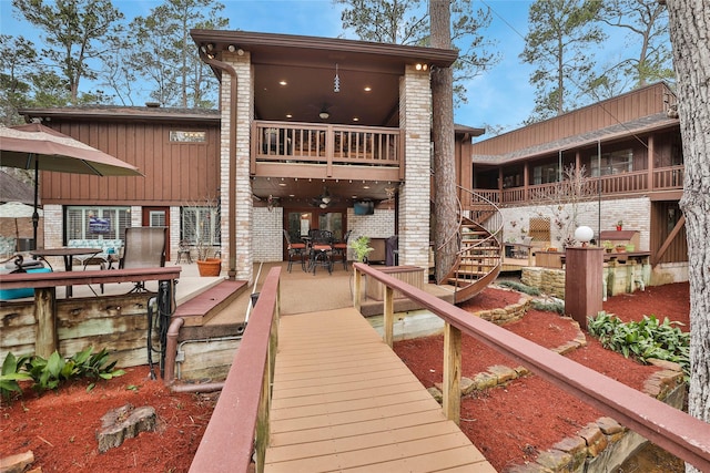 rear view of property with a balcony