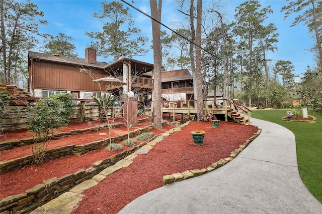 rear view of house featuring a yard