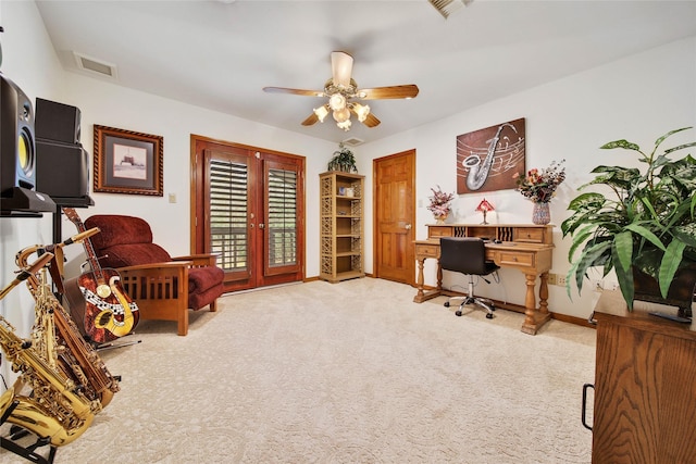 office space with carpet flooring, ceiling fan, and french doors