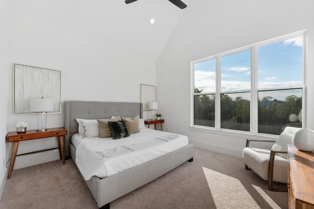 bedroom featuring light carpet, high vaulted ceiling, and ceiling fan