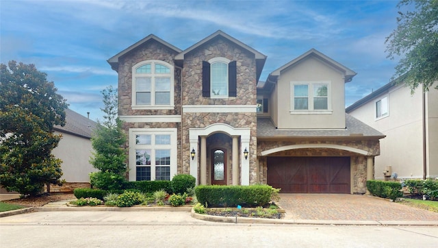 view of front of property with a garage