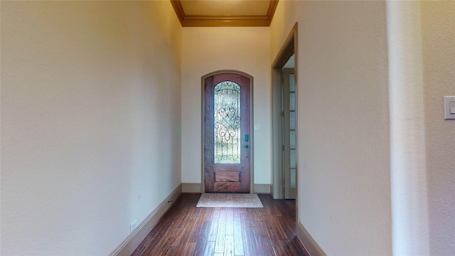 entrance foyer featuring dark hardwood / wood-style flooring and ornamental molding