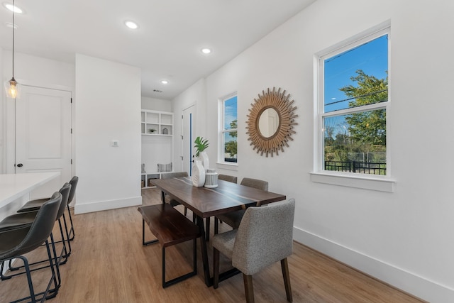 dining space featuring light wood-type flooring