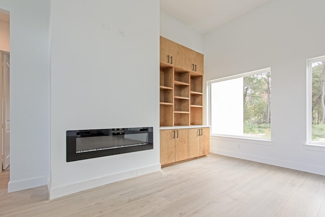 unfurnished living room featuring light hardwood / wood-style floors