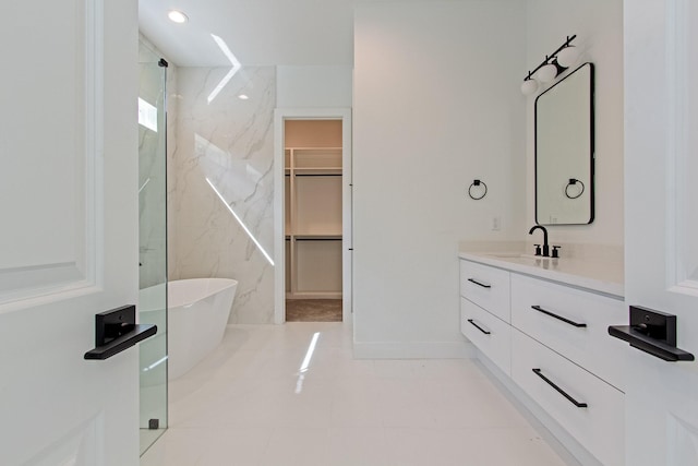 bathroom featuring plus walk in shower and vanity