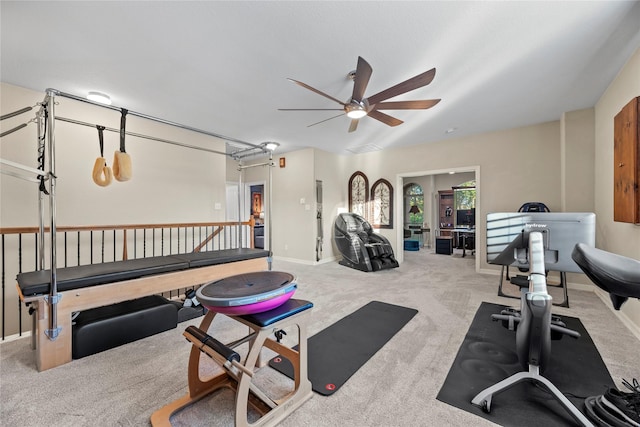 workout area with light carpet and ceiling fan