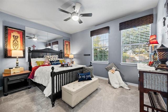 bedroom with ceiling fan and carpet floors