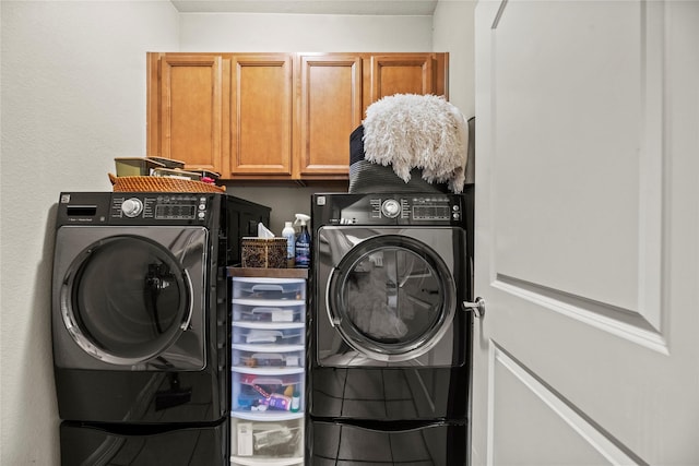 washroom with cabinets and independent washer and dryer