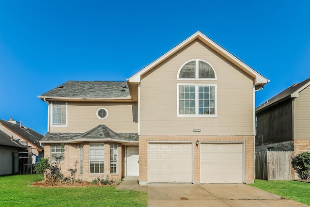 front facade with a front lawn and a garage