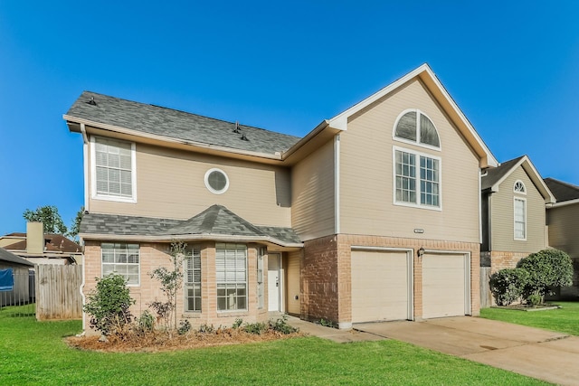 front of property featuring a garage and a front lawn