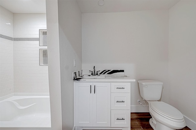 bathroom featuring hardwood / wood-style flooring and toilet