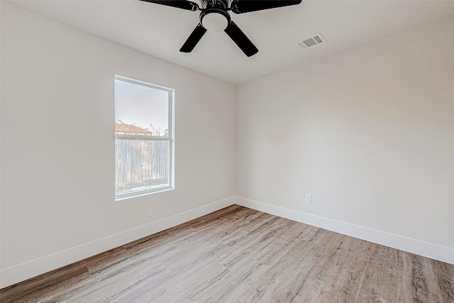 spare room featuring ceiling fan and light wood-type flooring