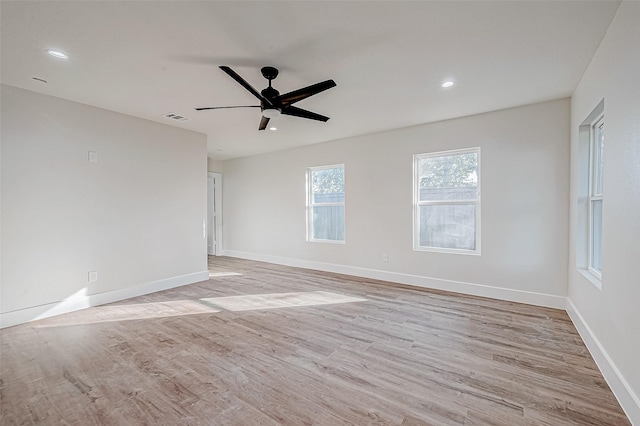 empty room featuring light hardwood / wood-style flooring and ceiling fan