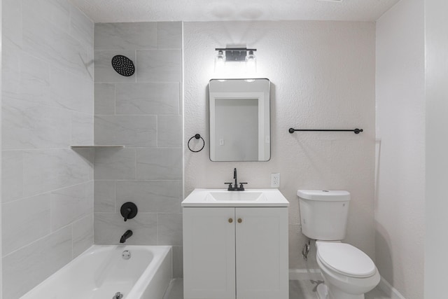 full bathroom featuring a textured ceiling, vanity, toilet, and tiled shower / bath