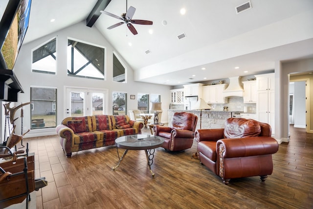 living room with beamed ceiling, high vaulted ceiling, ceiling fan, and dark wood-type flooring