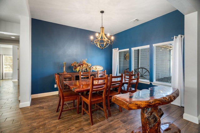 dining space with a notable chandelier