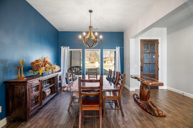 dining space featuring a chandelier and dark wood-type flooring