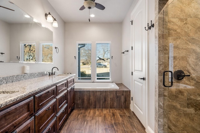 bathroom with vanity, separate shower and tub, and ceiling fan